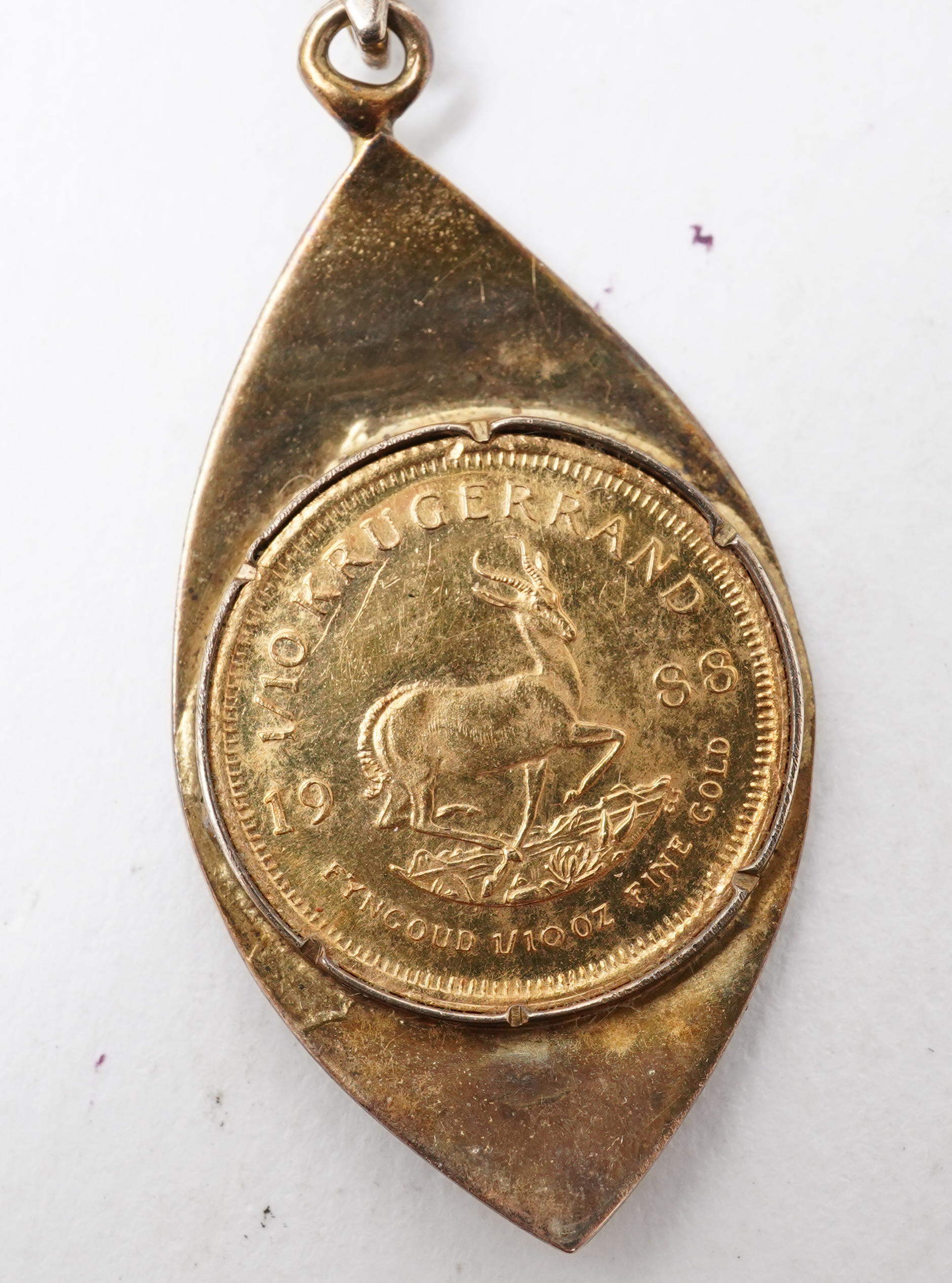 A gold 1/10 Krugerrand coin necklace, circa 1988 and later